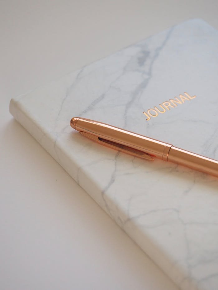 Gold Pen on Journal Book